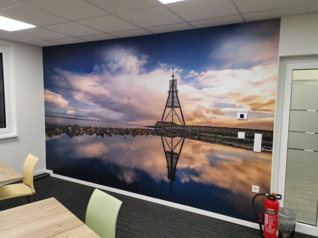 Photo wallpaper with a coastal scene at TAD Pharma.
